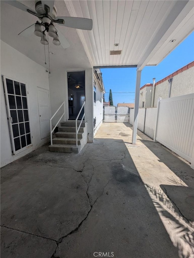 891 W Elberon Ave, San Pedro, CA 90731 - fenced backyard with ceiling fan, a patio area, and entry steps