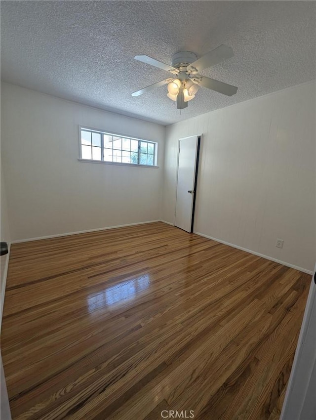 891 W Elberon Ave, San Pedro, CA 90731 - empty room with a textured ceiling, wood finished floors, and ceiling fan