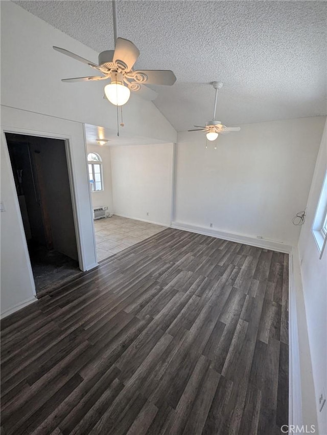 891 W Elberon Ave, San Pedro, CA 90731 - unfurnished living room with wood finished floors, a textured ceiling, plenty of natural light, vaulted ceiling, and a ceiling fan