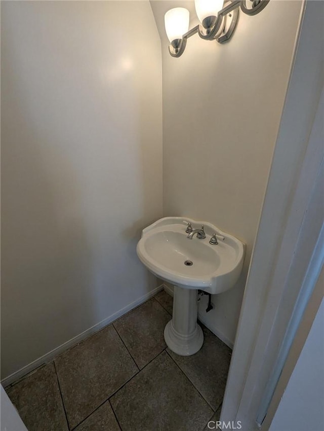 891 W Elberon Ave, San Pedro, CA 90731 - bathroom with tile patterned flooring and a chandelier