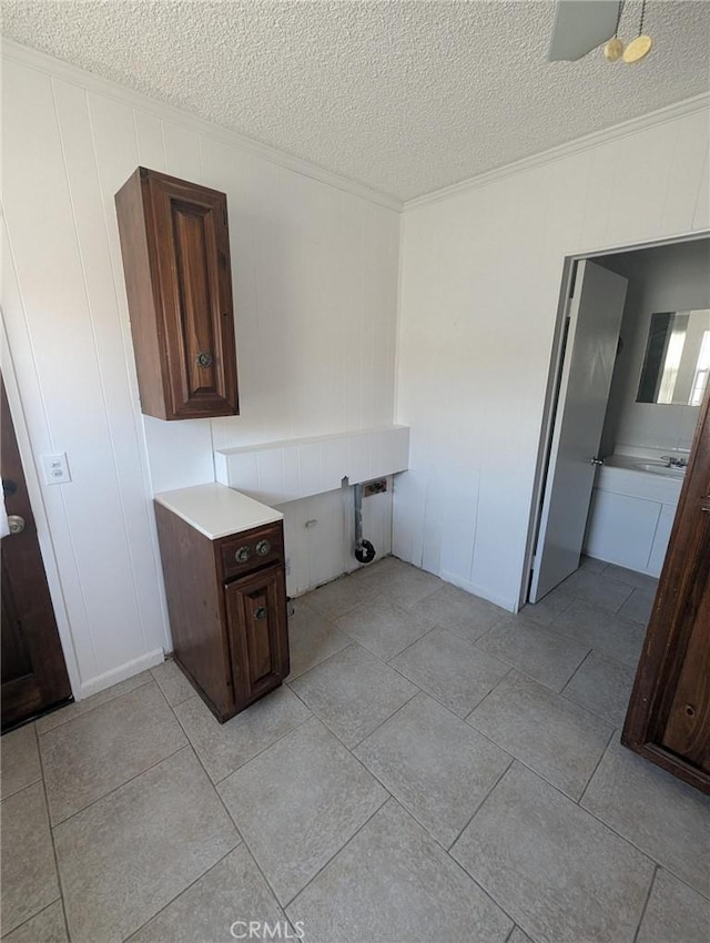 891 W Elberon Ave, San Pedro, CA 90731 - spare room with a textured ceiling, ornamental molding, and light tile patterned flooring