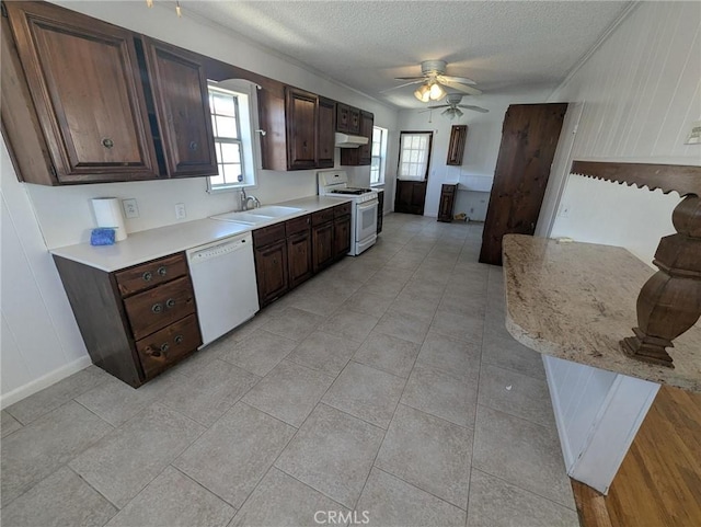 891 W Elberon Ave, San Pedro, CA 90731 - kitchen featuring white appliances, light countertops, ceiling fan, a textured ceiling, and dark brown cabinets
