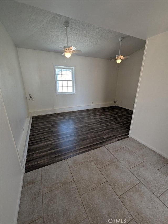 891 W Elberon Ave, San Pedro, CA 90731 - tiled empty room featuring a ceiling fan and a textured ceiling