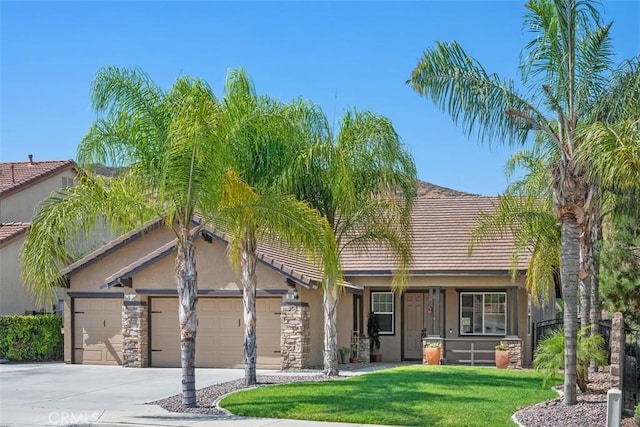 185 Alabaster Loop, Perris, CA 92570 - view of front of home featuring stucco siding, a front yard, a garage, and concrete driveway