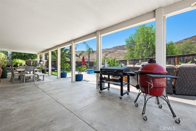 185 Alabaster Loop, Perris, CA 92570 - fenced backyard featuring a mountain view, outdoor dining space, a patio, and area for grilling