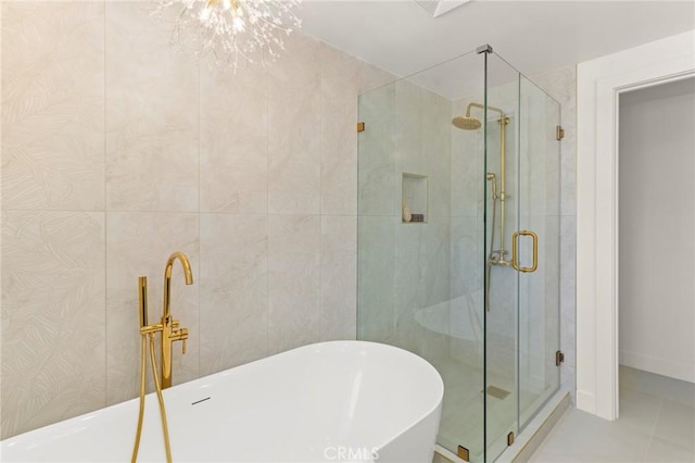 17698 Locust St, Fountain Valley, CA 92708 - bathroom featuring a freestanding bath, a shower stall, and tile patterned floors