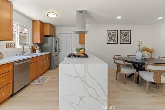 17698 Locust St, Fountain Valley, CA 92708 - kitchen featuring extractor fan, appliances with stainless steel finishes, brown cabinets, light stone countertops, and recessed lighting