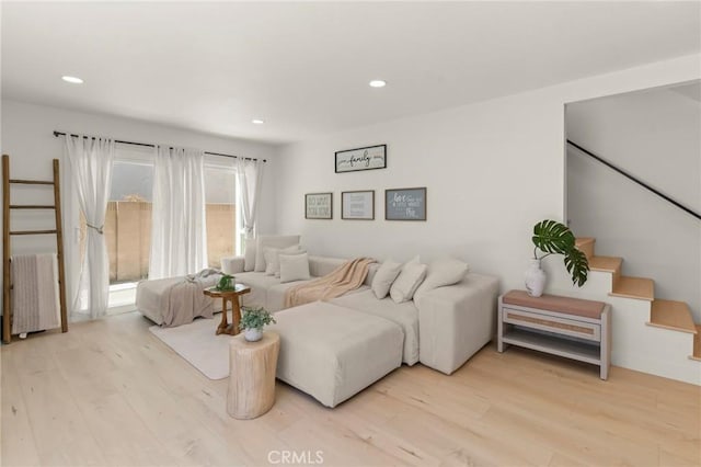 17698 Locust St, Fountain Valley, CA 92708 - living room featuring radiator heating unit, wood finished floors, recessed lighting, and stairs