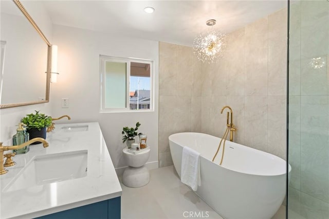 17698 Locust St, Fountain Valley, CA 92708 - full bath featuring double vanity, a freestanding bath, and a chandelier