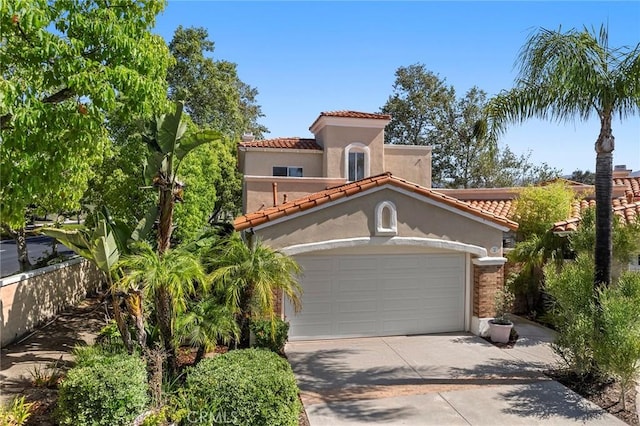 2 Via Barcaza, Coto De Caza, CA 92679 - mediterranean / spanish-style home with a tiled roof, a garage, driveway, and stucco siding
