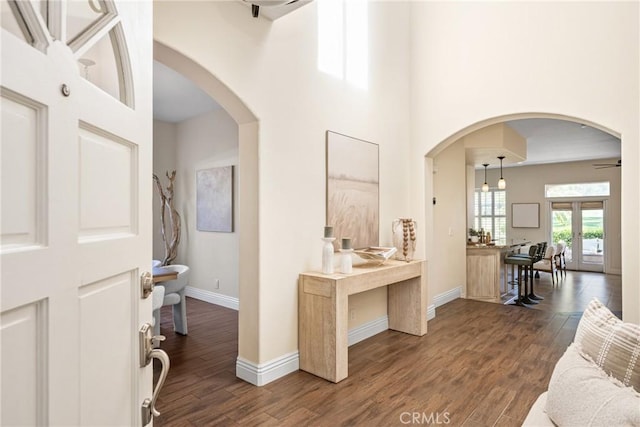 2 Via Barcaza, Coto De Caza, CA 92679 - foyer with dark wood-type flooring, arched walkways, and a towering ceiling
