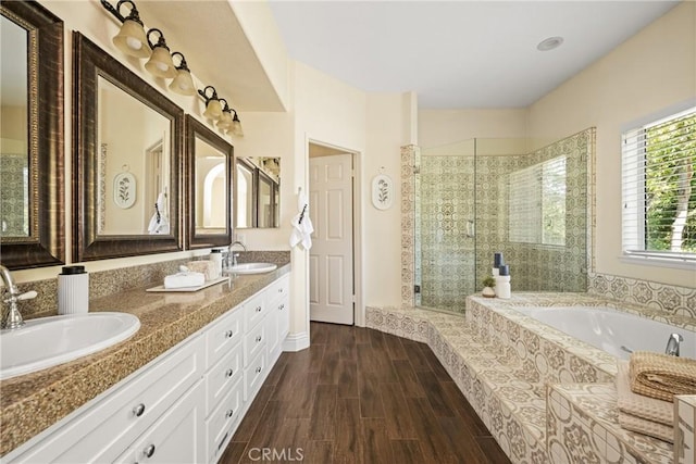 2 Via Barcaza, Coto De Caza, CA 92679 - bathroom with a stall shower, a bath, double vanity, and wood finished floors