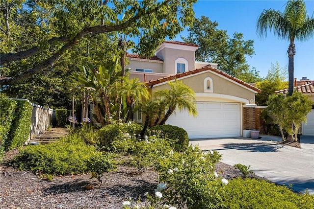 2 Via Barcaza, Coto De Caza, CA 92679 - mediterranean / spanish house featuring driveway, an attached garage, stucco siding, and a tiled roof