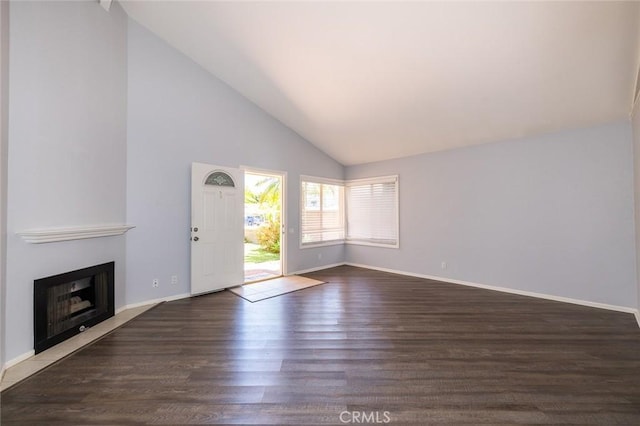24691 Tarazona, Mission Viejo, CA 92692 - unfurnished living room featuring a fireplace with flush hearth, wood finished floors, and high vaulted ceiling