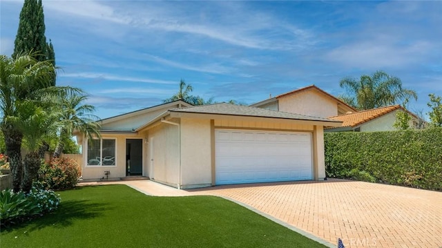 24691 Tarazona, Mission Viejo, CA 92692 - ranch-style home featuring an attached garage, a front yard, decorative driveway, and stucco siding