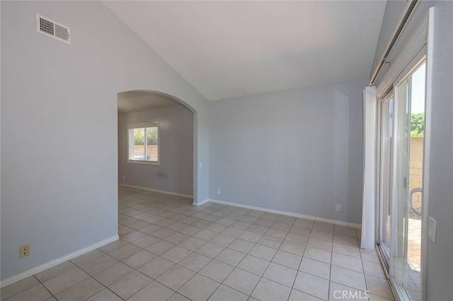 24691 Tarazona, Mission Viejo, CA 92692 - unfurnished room featuring arched walkways, lofted ceiling, and light tile patterned floors