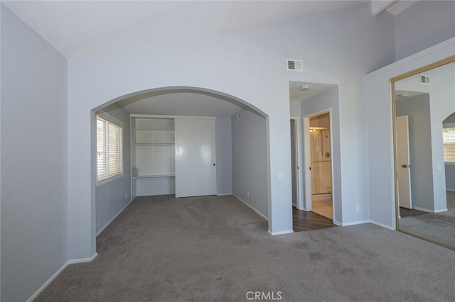 24691 Tarazona, Mission Viejo, CA 92692 - spare room with carpet flooring, arched walkways, plenty of natural light, and vaulted ceiling