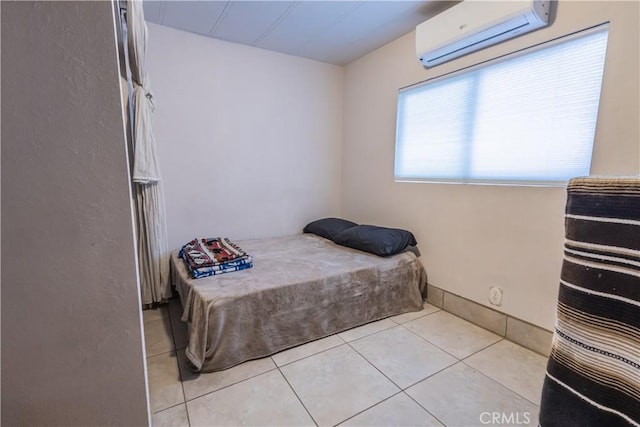 24000 Wheatfield Cir, Wildomar, CA 92595 - bedroom with a wall unit AC and light tile patterned flooring