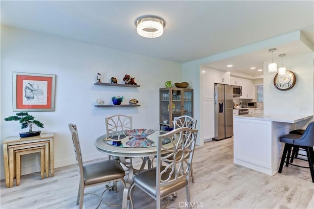 3365 Punta Alta Unit 2F, Laguna Woods, CA 92637 - dining room with light wood finished floors and recessed lighting