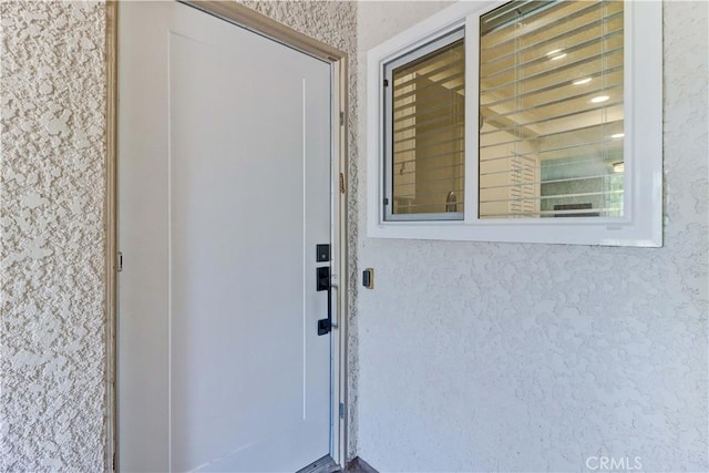 3365 Punta Alta Unit 2F, Laguna Woods, CA 92637 - entrance to property with stucco siding