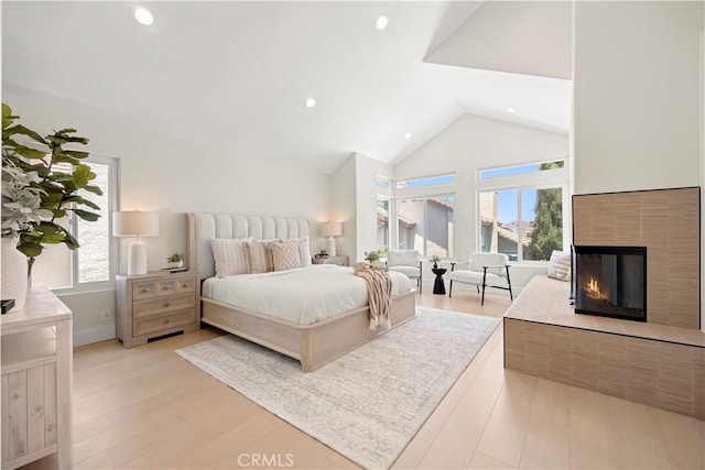 24876 Avenida Avalon, Laguna Hills, CA 92653 - bedroom with multiple windows, light wood-type flooring, a multi sided fireplace, high vaulted ceiling, and recessed lighting