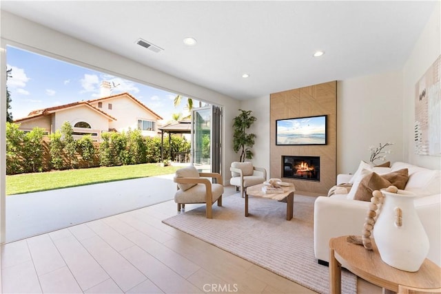 24876 Avenida Avalon, Laguna Hills, CA 92653 - living room with a tiled fireplace, recessed lighting, and wood finished floors