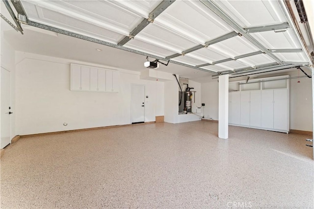 24876 Avenida Avalon, Laguna Hills, CA 92653 - garage with a garage door opener and strapped water heater