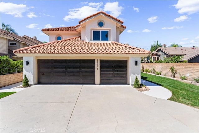 24876 Avenida Avalon, Laguna Hills, CA 92653 - mediterranean / spanish home featuring stucco siding, a garage, concrete driveway, and a tiled roof
