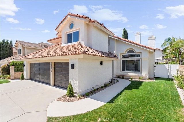 24876 Avenida Avalon, Laguna Hills, CA 92653 - mediterranean / spanish house with a gate, concrete driveway, a tile roof, and stucco siding