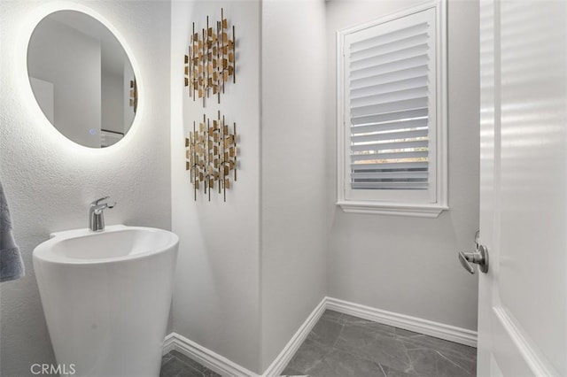 2886 Muir Trail Dr, Fullerton, CA 92833 - bathroom featuring baseboards and marble look tiles
