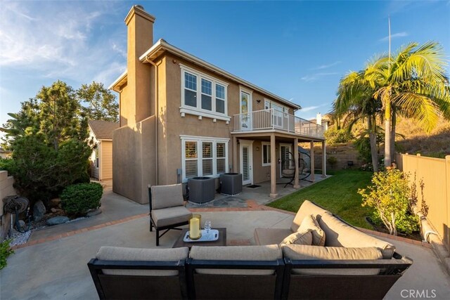 2886 Muir Trail Dr, Fullerton, CA 92833 - rear view of house featuring a patio area, an outdoor living space, a balcony, stucco siding, and a chimney