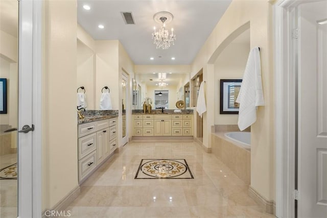 2886 Muir Trail Dr, Fullerton, CA 92833 - full bath with a chandelier, a garden tub, two vanities, and recessed lighting