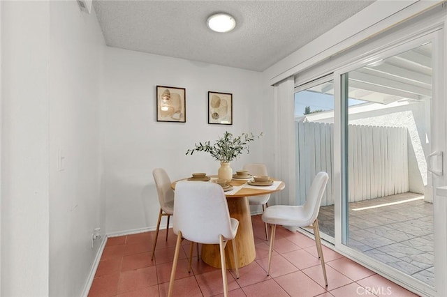 8515 Edgebrook Dr, Garden Grove, CA 92844 - dining area featuring a textured ceiling and tile patterned flooring