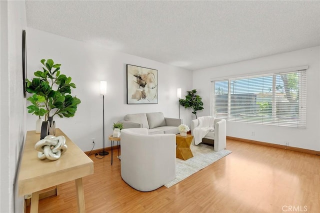 8515 Edgebrook Dr, Garden Grove, CA 92844 - living room featuring light wood-style flooring and a textured ceiling