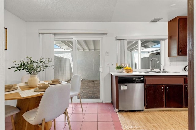 8515 Edgebrook Dr, Garden Grove, CA 92844 - kitchen featuring dishwasher, light countertops, light tile patterned flooring, and tasteful backsplash