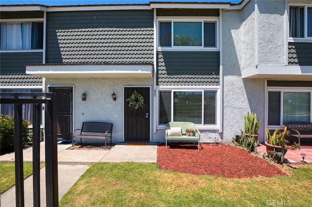 8515 Edgebrook Dr, Garden Grove, CA 92844 - view of front of home featuring stucco siding, a patio area, and a front lawn