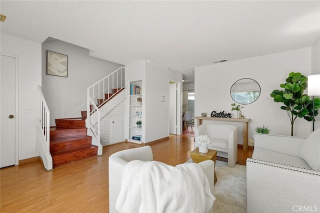 8515 Edgebrook Dr, Garden Grove, CA 92844 - living room with light wood-style floors and stairway