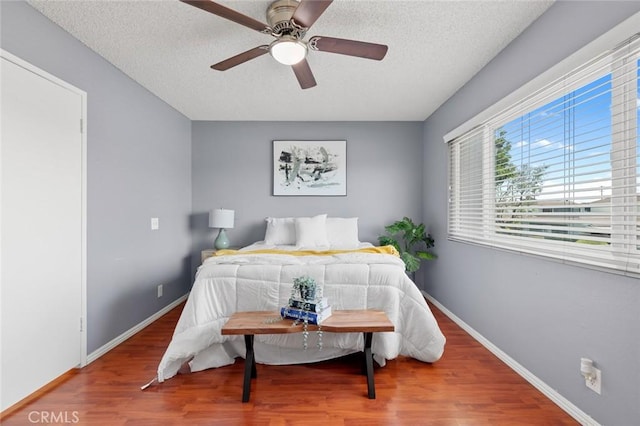8515 Edgebrook Dr, Garden Grove, CA 92844 - bedroom featuring wood finished floors, a textured ceiling, and ceiling fan