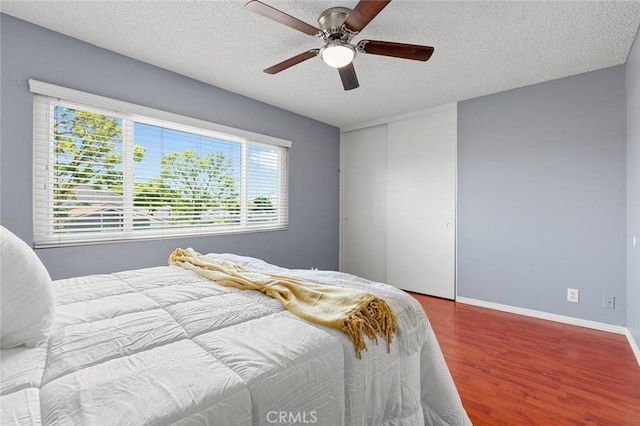 8515 Edgebrook Dr, Garden Grove, CA 92844 - bedroom featuring wood finished floors, a textured ceiling, ceiling fan, and a closet