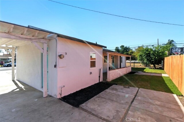 3839 Riverside Dr, Chino, CA 91710 - view of property exterior with stucco siding and an attached carport