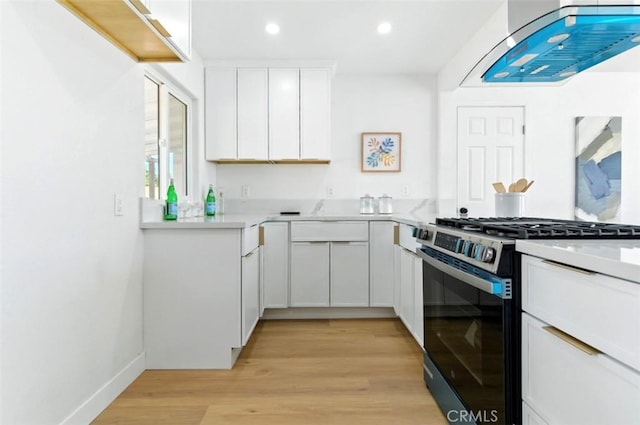 3839 Riverside Dr, Chino, CA 91710 - kitchen featuring gas range, ventilation hood, recessed lighting, white cabinets, and light wood-style flooring