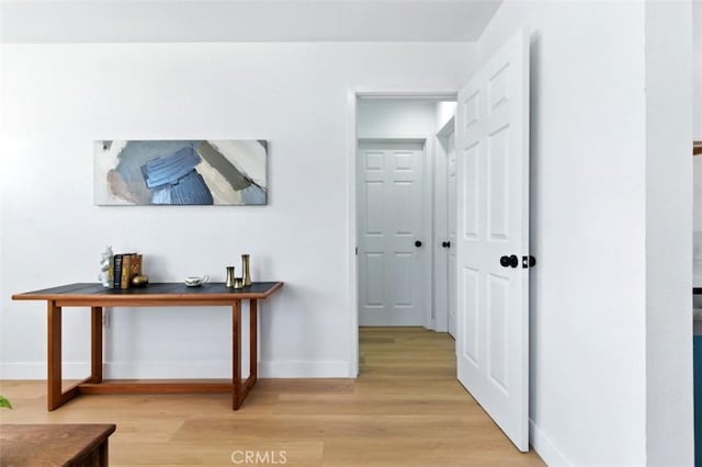 3839 Riverside Dr, Chino, CA 91710 - hall with baseboards and light wood-type flooring