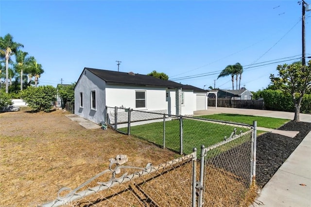 3839 Riverside Dr, Chino, CA 91710 - view of front facade with concrete driveway, stucco siding, and a gate