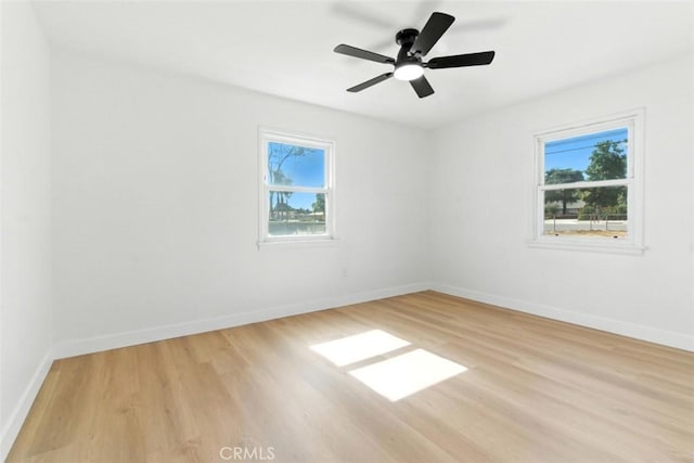 3839 Riverside Dr, Chino, CA 91710 - spare room with healthy amount of natural light, light wood-style floors, and ceiling fan
