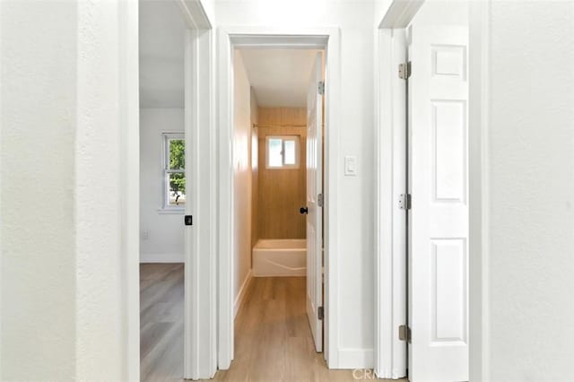 3839 Riverside Dr, Chino, CA 91710 - corridor with light wood-style flooring and baseboards