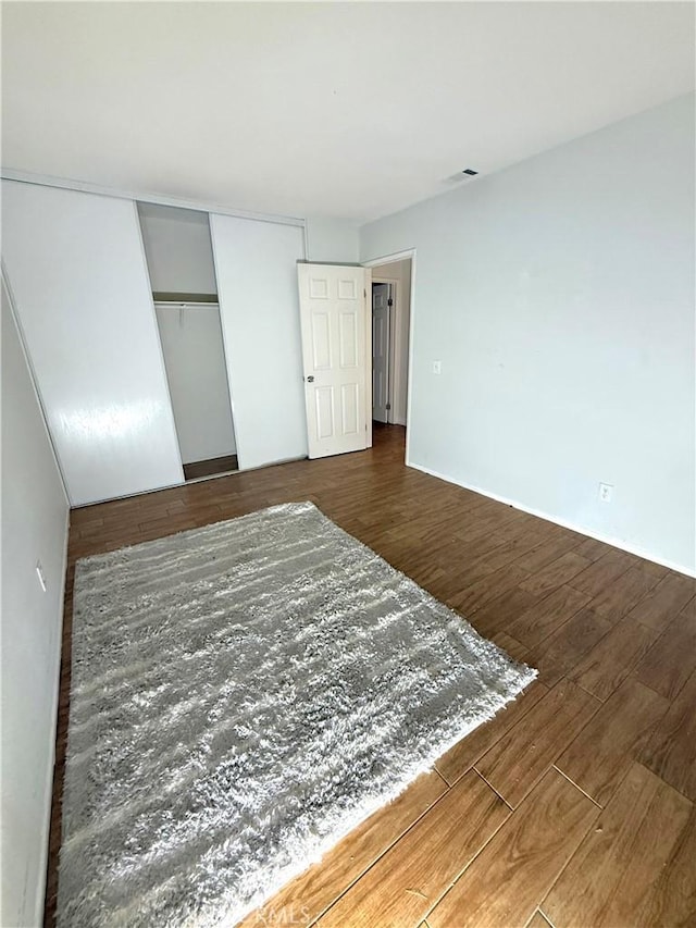 24423 Dunlavy Ct, Moreno Valley, CA 92557 - bedroom featuring wood finished floors and a closet