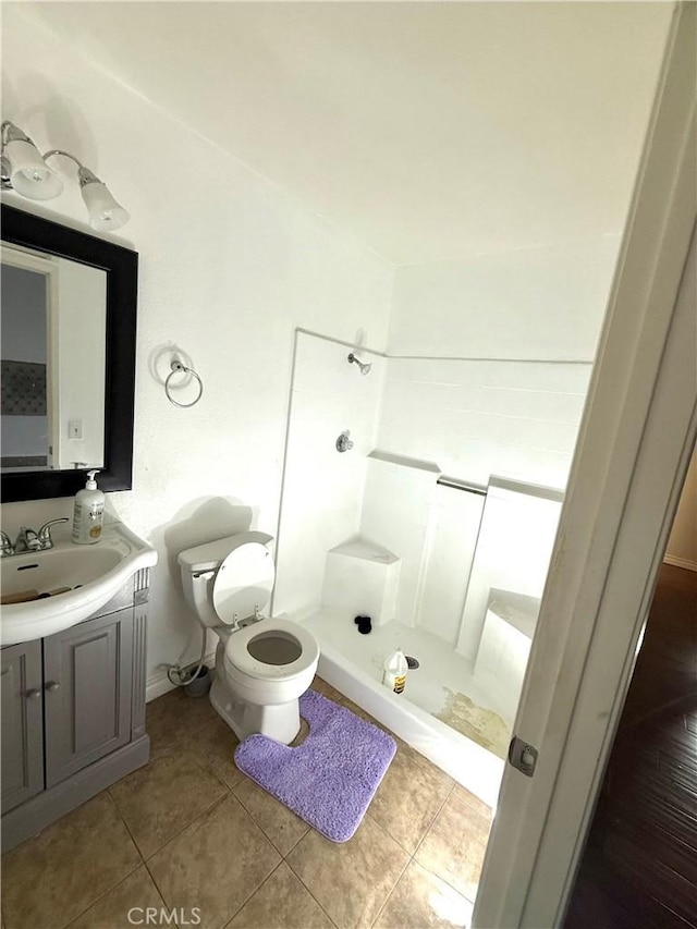 24423 Dunlavy Ct, Moreno Valley, CA 92557 - full bathroom with a stall shower, vanity, and tile patterned floors