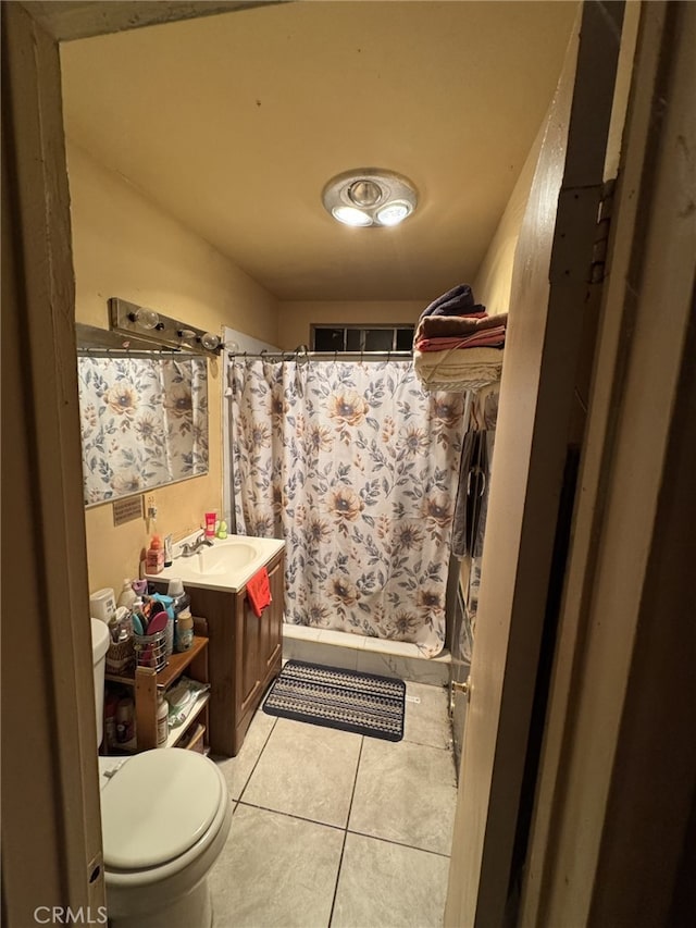 629 S Sage Ave, Rialto, CA 92376 - bathroom featuring tile patterned flooring, vanity, and a shower with curtain