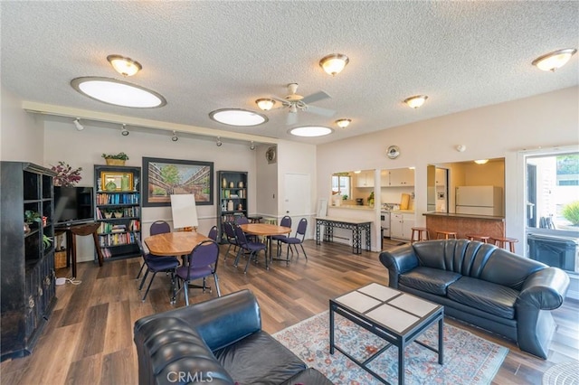 3115 Merrill Dr Unit 59, Torrance, CA 90503 - living room with a textured ceiling, ceiling fan, wood finished floors, and rail lighting