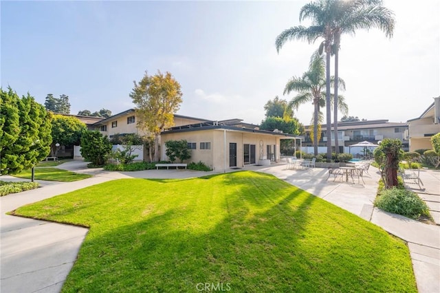 3115 Merrill Dr Unit 59, Torrance, CA 90503 - view of front of house with a front yard, stucco siding, and a patio